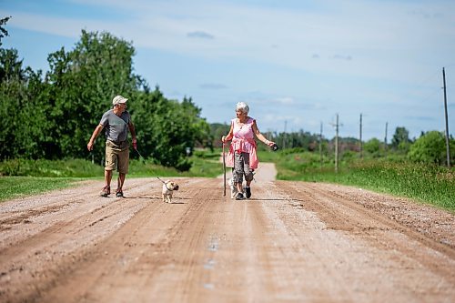 MIKAELA MACKENZIE / WINNIPEG FREE PRESS


Michael Martin and his sister, Evelyn Doerksen, walk their dogs Maddy and Coral near Elma, Manitoba on Thursday, June 22, 2023.  For Eva Wasney story.
Winnipeg Free Press 2023