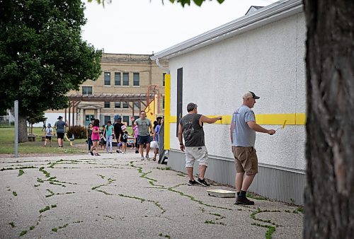 JESSICA LEE / WINNIPEG FREE PRESS

Workers paint over a portion of Keewatin Prairie Community School which was tagged with hate messages June 23, 2023.

Reporter: Malak