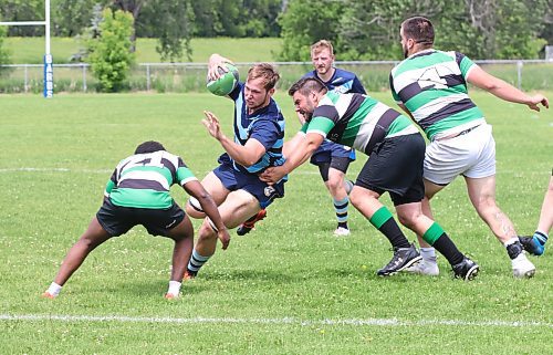 Robin Roberts of the Brandon Barbarians manages to get past a tackle by David Habibi of the Wanderers to put the ball down for a try during their Rugby Manitoba Men&#x2019;s Premier 2 game at John Reilly Field on Saturday afternoon. The Barbs won 38-24, with Roberts, Dustin Everett and Miguel Dominguez each scoring a pair of tries and Cameron Elder booting four conversions. (Perry Bergson/The Brandon Sun)
June 24, 2023