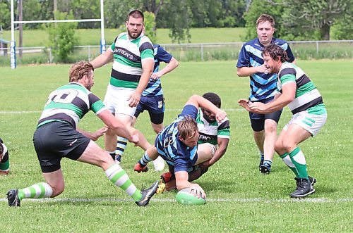 Robin Roberts of the Brandon Barbarians manages to get past a tackle by David Habibi of the Wanderers to put the ball down for a try during their Rugby Manitoba Men&#x2019;s Premier 2 game at John Reilly Field on Saturday afternoon. The Barbs won 38-24, with Roberts, Dustin Everett and Miguel Dominguez each scoring a pair of tries and Cameron Elder booting four conversions. (Perry Bergson/The Brandon Sun)
June 24, 2023