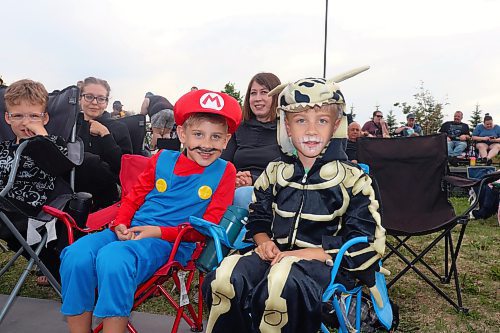 Twin brothers Quinn and Emmett Vrooman dress up at Mario and Dry Bones, respectively, during a free outdoor screening for “The Super Mario Bros. Movie,” which took place at the Riverbank Discovery Centre grounds Saturday evening. (Kyle Darbyson/The Brandon Sun)