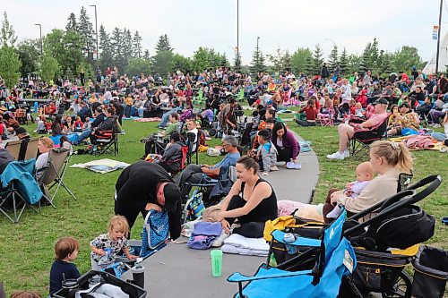 Dozens of local families take a seat at the Fusion Credit Union Stage Saturday night to enjoy a free outdoor screening of The Super Mario Bros. Movie. (Kyle Darbyson/The Brandon Sun)