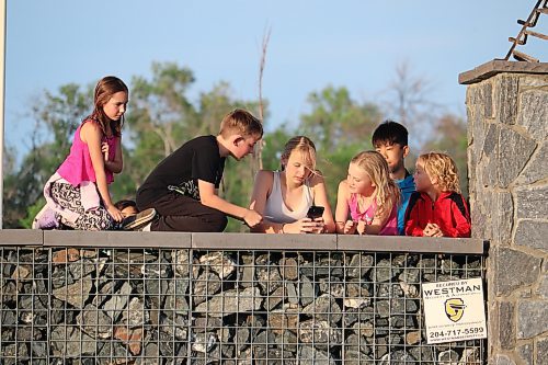 Local youth explore the Riverbank Discovery Centre grounds Saturday evening with the hope of winning a scavenger hunt. This activity served as a preview for the movie. (Kyle Darbyson/The Brandon Sun)