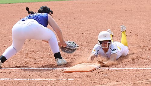 Westman Magic base runner Presley Hodson dives safely back into the bag as Central Energy first baseman Rebecca Anderson tries to tag her in Manitoba Premier Softball League under-15 action at Ashley Neufeld Softball Complex on Sunday afternoon. Central won the game 8-2. (Perry Bergson/The Brandon Sun)
June 25, 2023