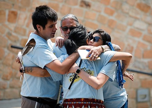 JOHN WOODS / WINNIPEG FREE PRESS
Joseph Fourre, centre, his son Dylan, and his daughter Nicole Labossiere  are comforted by a supporter at a Fentanyl Awareness Walk and rally at Oodeena square. Fourre&#x573; son Harlan Fourre and ex-wife Miranda Paupaneks died of fentanyl overdoses.

Reporter: May