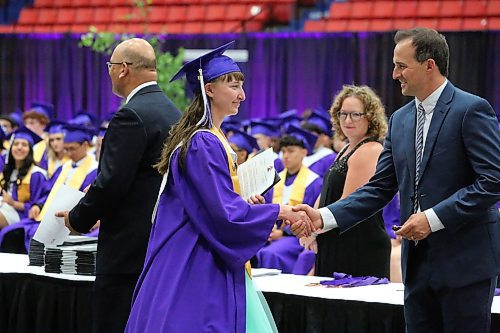 Danika Robb picks up her diploma during Monday’s Vincent Massey High School graduation ceremony at the Keystone Centre. (Kyle Darbyson/The Brandon Sun)