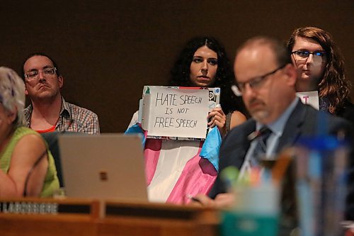 A Brandon School Division board meeting attendee holds up a sign that states "Hate Speech is Not Free Speech" on Monday evening. Local members of the LGBTQ+ community have rallied over the last couple weeks to ensure that the division does not institute a book review committee, given that the original person who suggested this initiative predominantly flagged material featuring gender diverse people as being inappropriate for children. (Kyle Darbyson/The Brandon Sun)