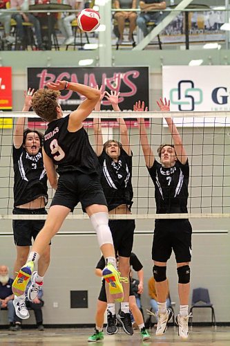 Garden Valley Zodiacs Jesse Vanden Berg attacks against a trio of Neelin Spartans blockers during the final of BU's varsity boys volleyball tournament on Saturday. Garden Valley won in straight sets. (Thomas Friesen/The Brandon Sun)