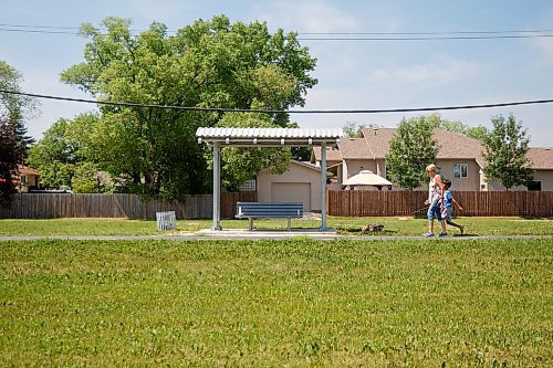 MIKE DEAL / WINNIPEG FREE PRESS
Dorothy Franklin with her grandson Riley, 9, and dog, Sadie walk along the Northeast Pioneers Greenway which runs alongside the area where the coyote attacked a nine-year-old boy Saturday night.
230626 - Monday, June 26, 2023.