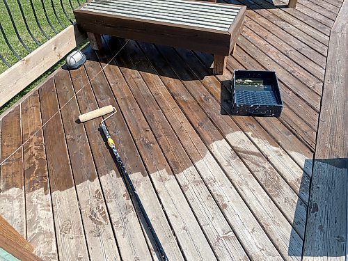 Photos by Marc LaBossiere / Winnipeg Free Press
The canola oil was applied to the aged and grey-faded top decking using a tray and roller. 