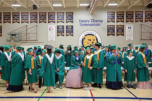 27062023
&#xc9;cole Secondaire Neelin High School graduates visit while waiting to enter the main gymnasium at the Brandon University Healthy Living Centre for their graduation and convocation ceremonies on Tuesday. (Tim Smith/The Brandon Sun)