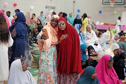 28062023
Girls take photos together during Eid al-Adha celebrations with other members of southwestern Manitoba’s Muslim community at the Brandon University Healthy Living Centre on Wednesday.  (Tim Smith/The Brandon Sun)