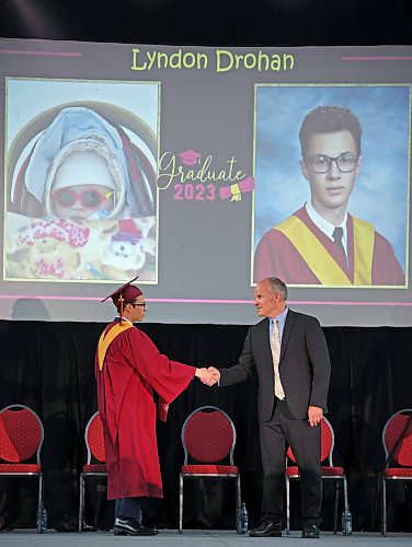28062023
Lyndon Drohan receives his diploma from principal Chad Cobb during Crocus Plains Regional Secondary School&#x2019;s class of 2023 graduation and convocation ceremonies at Westoba Place on Wednesday afternoon. (Tim Smith/The Brandon Sun)