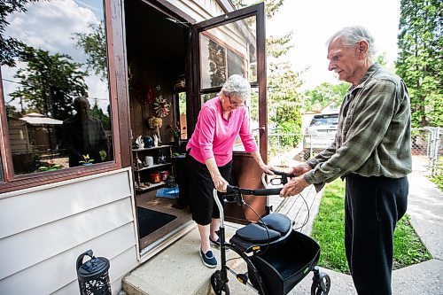 MIKAELA MACKENZIE / WINNIPEG FREE PRESS


Jim Hannah helps Cathy down the steps (in the walker that they have rented out-of-pocket) at their home on Wednesday, June 28, 2023.  Cathy has been forced to attempt her own rehab after the province denied her coverage for physiotherapy because she &quot;only&quot; received a partial hip replacement. For Malak Abas story.
Winnipeg Free Press 2023