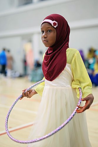 28062023
A young girl plays with a hula-hoop during Eid al-Adha celebrations with other members of southwestern Manitoba&#x2019;s Muslim community at the Brandon University Healthy Living Centre on Wednesday.  (Tim Smith/The Brandon Sun) 