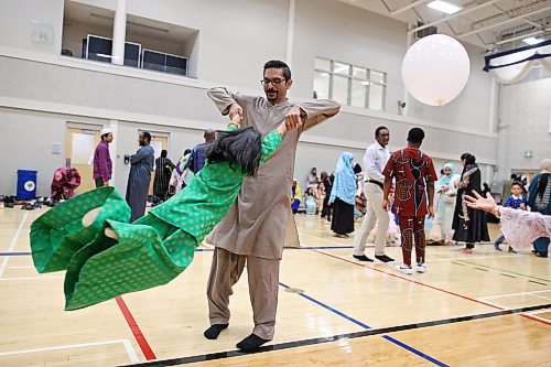 28062023
Asad Awan swings his daughter Zaaira during Eid al-Adha celebrations with other members of southwestern Manitoba&#x2019;s Muslim community at the Brandon University Healthy Living Centre on Wednesday.  (Tim Smith/The Brandon Sun) 