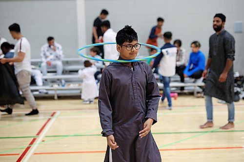 28062023
Hashir Ali plays with a hula-hoop during Eid al-Adha celebrations with other members of southwestern Manitoba&#x2019;s Muslim community at the Brandon University Healthy Living Centre on Wednesday.  (Tim Smith/The Brandon Sun) 