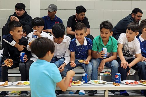 28062023
Young boys eat together during Eid al-Adha celebrations with other members of southwestern Manitoba&#x2019;s Muslim community at the Brandon University Healthy Living Centre on Wednesday.  (Tim Smith/The Brandon Sun) 
