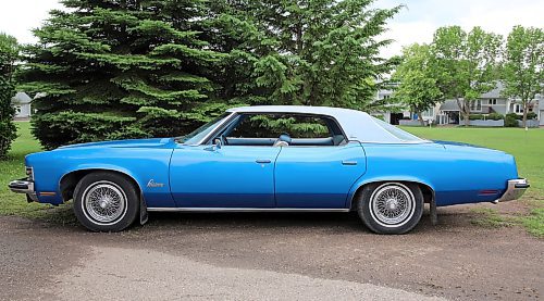 Norm Popien's 1973 Pontiac Parisienne Brougham four-door hardtop sits in a park in Brandon on Wednesday. (Michele McDougall/The Brandon Sun).