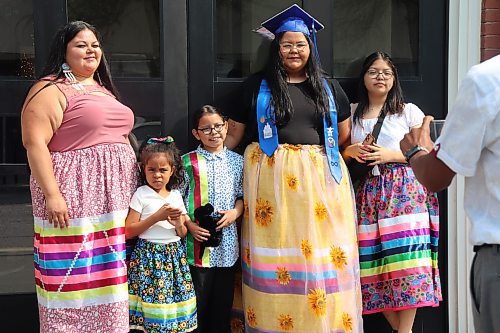 Prairie Hope High School graduate Ava-Marie McKay poses for a photo with her family outside The Firehall event venue following Thursday morning’s graduation ceremony in downtown Brandon. (Kyle Darbyson/The Brandon Sun)