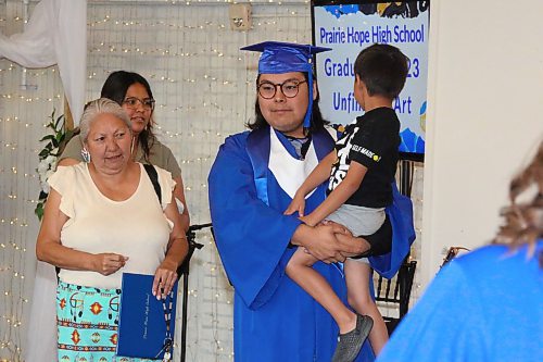 Wakinyan Sandy celebrates graduating from Prairie Hope High School with his family following Thursday morning’s graduation ceremony at The Firehall event venue. (Kyle Darbyson/The Brandon Sun)