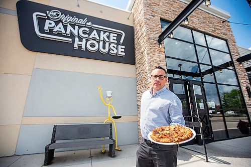 MIKAELA MACKENZIE / WINNIPEG FREE PRESS


Terry Friesen, general manager, holds a Giant Apple Pancake at the Original Pancake House on McGillivray on Thursday, June 29, 2023.   For Dave Sanderson story.
Winnipeg Free Press 2023