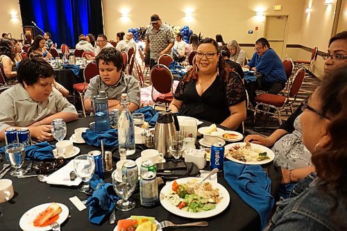 Melanie Cameron (centre) graduated from Yellowquill University College in Winnipeg this year with a rehabilitation assistant diploma. Cameron was celebrated with other graduates from Rolling River First Nation at a luncheon at the Victoria Inn in Brandon on Friday, June 30. (Miranda Leybourne/The Brandon Sun)