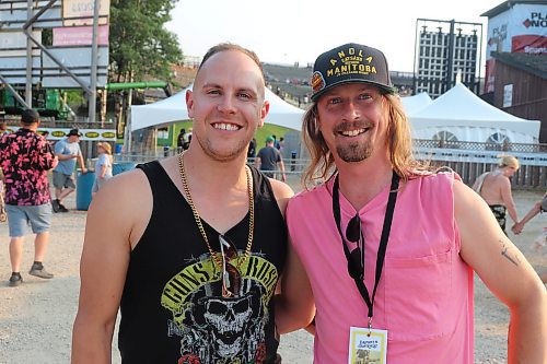 JR Charron and guitarist Max Dupas, AKA Hamburger Island, pose for a photo at the entrance to the Play Now Stage during the first full day of Dauphin's Countryfest 2023. Charron was scheduled to make his official Countryfest debut at the Bell Hilltop Stage later that evening. (Kyle Darbyson/The Brandon Sun) 