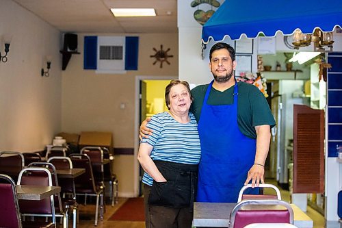 MIKAELA MACKENZIE / WINNIPEG FREE PRESS

Athanasios Karasoulis and Theodora Karasoulis, owners of Santorini Restaurant &amp; Catering (which is closing today) on Portage on Friday, June 30, 2023. For Gabby Piche story.
Winnipeg Free Press 2023.