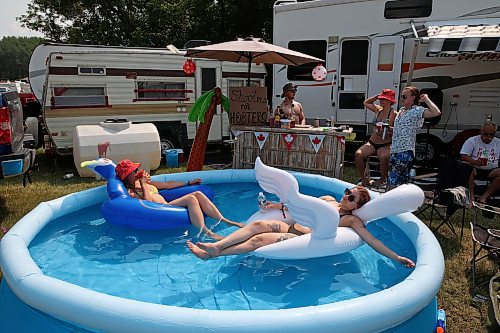 30062023
Campers relax in the campground at Dauphin&#x2019;s Countryfest 2023 on a hot Friday afternoon.
(Tim Smith/The Brandon Sun)