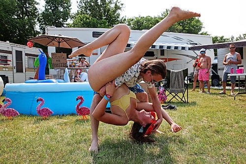 30062023
Bryce Dubek and Halle Dupre dance at their campsite at Dauphin&#x2019;s Countryfest 2023 on a hot Friday afternoon.
(Tim Smith/The Brandon Sun)
