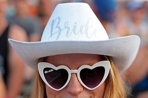 30062023
A woman watches Tim Hicks perform on the main stage at Dauphin&#x2019;s Countryfest 2023 on Friday evening.
(Tim Smith/The Brandon Sun)
