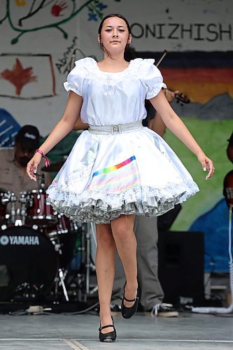 01072023
Shaylene Chartrand with Miss Sandi Bay and the Rainbow Tornadoes jigs for a large crowd in Wasagaming during Canada Day celebrations at Riding Mountain National Park on Saturday.
(Tim Smith/The Brandon Sun)