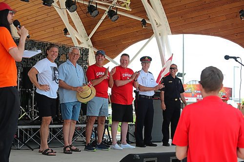 Some local dignitaries take part in the opening ceremonies for Brandon’s Canada Day celebration at the Fusion Credit Union Stage. They are, from left to right, Mayor Jeff Fawcett, Brandon-Souris MP Larry Maguire, Brandon West MLA Reg Hewler, Brandon East MLA Isleifson, acting Brandon Police Service chief Randy Lewis and Brandon Fire and Emergency Services deputy chief Marc Lefebvre. (Kyle Darbyson/The Brandon Sun)