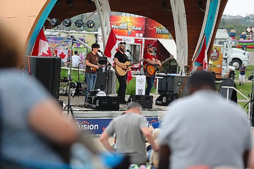 Members of The Janzen Boys perform on the Fusion Credit Union Stage during Brandon’s Canada Day festivities at the Riverbank Discovery Centre grounds. (Kyle Darbyson/The Brandon Sun)