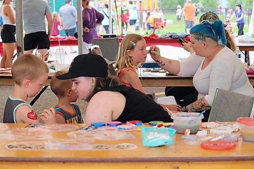 Some local youth get their arms and faces painted during Brandon’s Canada Day festivities at the Riverbank Discovery Centre grounds. (Kyle Darbyson/The Brandon Sun)