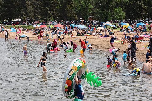 Beach-goers enjoy the sand and water at Clear Lake in Wasagaming during Canada Day celebrations at Riding Mountain National Park on Saturday. (Tim Smith/The Brandon Sun)