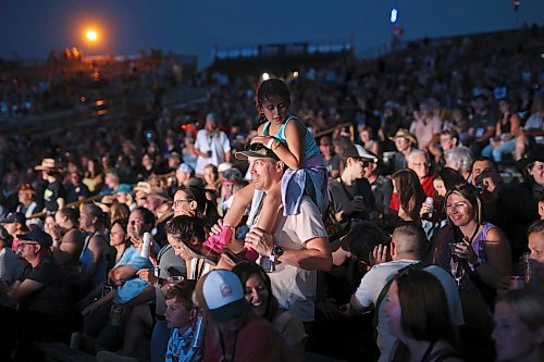 Mike Lee holds his niece Brooklyn Pernarowski on his shoulders while watching Walker Hayes perform on the main stage at Dauphin’s Countryfest 2023 on Friday evening. (Tim Smith/The Brandon Sun)
