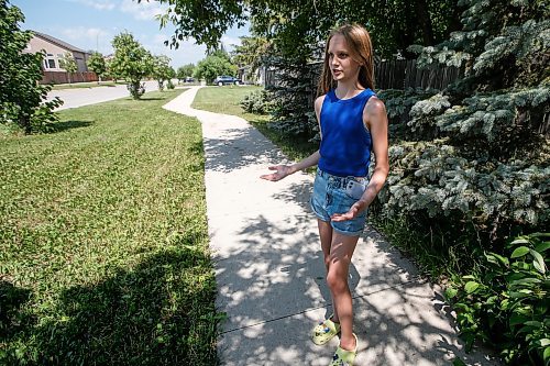 JOHN WOODS / WINNIPEG FREE PRESS
Aislin McAuliffe talks to media near the location of a second coyote attack in North Kildonan, Winnipeg Sunday, July 2, 2023. On June 30 a four year was attacked by a coyote.

Reporter: clarke