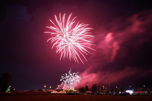 A burst of fiery red fireworks light up the sky over the Riverbank Discovery Centre on Saturday night, to mark the end of Canada Day 2023 in Brandon. (Matt Goerzen/The Brandon Sun)