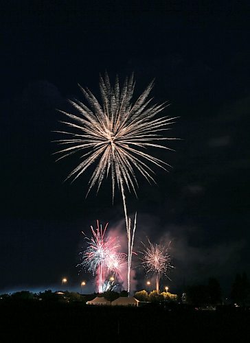 A sparkling golden flower bursts over Brandon's Riverbank Discovery Centre on Saturday as the city celebrates the end of Canada Day 2023 with a grand fireworks display. (Matt Goerzen/The Brandon Sun)