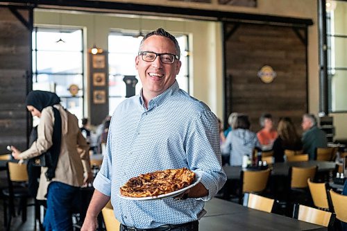 MIKAELA MACKENZIE / WINNIPEG FREE PRESS


Terry Friesen, general manager, holds a Giant Apple Pancake at the Original Pancake House on McGillivray on Thursday, June 29, 2023.   For Dave Sanderson story.
Winnipeg Free Press 2023