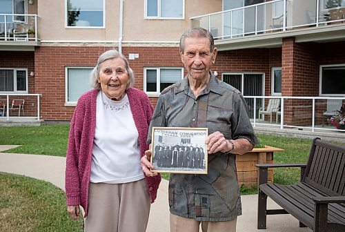 JESSICA LEE / WINNIPEG FREE PRESS

Rev. Gordon Hendrickson (right) is photographed with his wife Grace at the retirement complex where they live on June 28, 2023. He holds a photo of his graduation, he is on the bottom left.

Reporter: Brenda Suderman