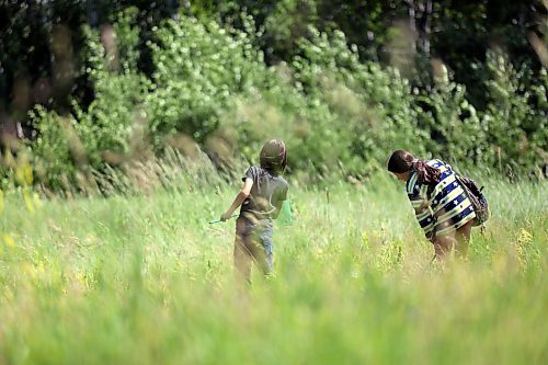 Kids out bug hunting in the Brandon Hills Wildlife Management Area on Monday afternoon. (Matt Goerzen/The Brandon Sun)