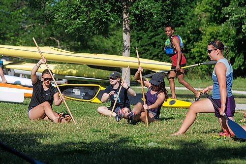 MIKE DEAL / WINNIPEG FREE PRESS
(From left) Nora Hanson, Scarlett Larsen, Baran Bamshad, and Esm&#xe9; Boning, members of the Provincial Team Toba Canoe and Kayak club do some dry land workouts during training Monday morning at the Manitoba Canoe and Kayak Center.
230703 - Monday, July 03, 2023.