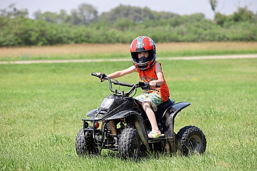 03072023
Five-year-old Ryatt Betts cruises around a family property west of Brandon on a mini quad on Monday.
(Tim Smith/The Brandon Sun)