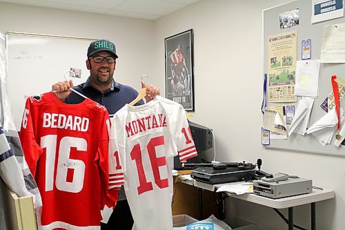 Brandon University athlete services and events co-ordinator Tyler Crayston holds signed Connor Bedard and Joe Montana jerseys, which are up for grabs at the Bobcats BIRT Cup golf tournament this Friday. (Thomas Friesen/The Brandon Sun)