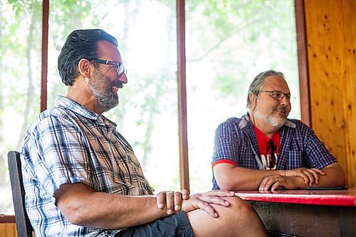 MIKAELA MACKENZIE / WINNIPEG FREE PRESS

Kerry Seabrook (left) and Art Zuke chat with the Free Press in the cabin front porch in Sandy Hook on Monday, July 3, 2023. For Jen story.
Winnipeg Free Press 2023.