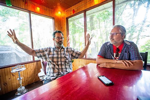 MIKAELA MACKENZIE / WINNIPEG FREE PRESS

Kerry Seabrook (left) and Art Zuke chat with the Free Press in the cabin front porch in Sandy Hook on Monday, July 3, 2023. For Jen story.
Winnipeg Free Press 2023.