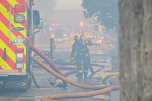 MIKE DEAL / WINNIPEG FREE PRESS
WFPS crews try to douse a large fire in the block on the southwest corner of Sutherland Avenue and Maple Street North Tuesday morning. 
230704 - Tuesday, July 4, 2023. 